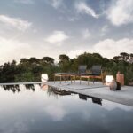 SWAY collection by HENRIK PEDERSEN.In outdoor situations we often spend more time relaxing and lounging, and when dining we tend to take our time. So why not make the situation as comfortable as possible? With SWAY, Danish designer HENRIK PEDERSEN has combined a finely proportioned teak frame with a practical sling seat and back to deliver inherent sprung comfort despite an extremely minimal profile.