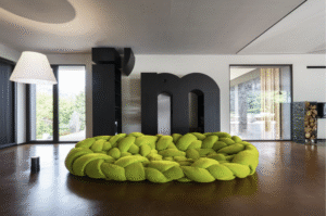 BOA by FERNANDO E HUMBERTO CAMPANA. Boa is a large woven nest. An enveloping hug. An invitation to explore different positions by lying down between its cushions.