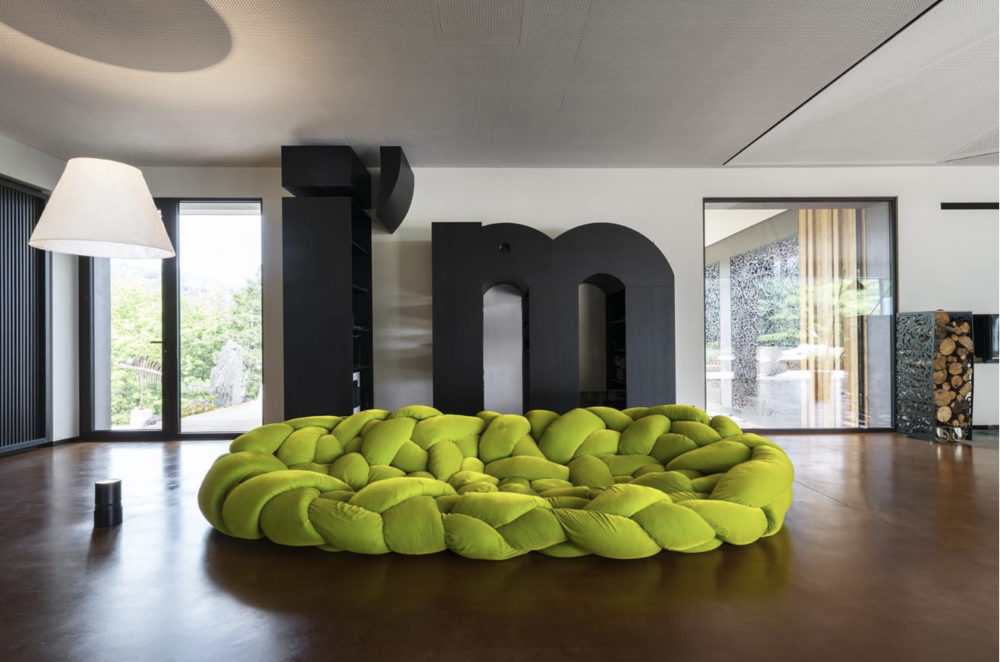 BOA by FERNANDO E HUMBERTO CAMPANA. Boa is a large woven nest. An enveloping hug. An invitation to explore different positions by lying down between its cushions.