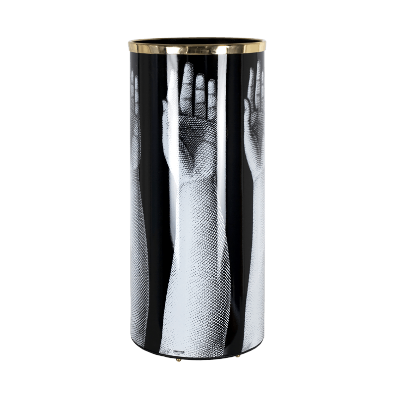 UMBRELLA STAND MANI. WHEREVER YOU MAY FIND SHELTER AFTER A WALK UNDER THE RAIN, MAKE SURE YOUR UMBRELLA STANDS IN FORNASETTI UMBRELLA STAND. ITS EXCEPTIONALLY CRAFTED SHAPE AND CAREFULLY SELECTED DESIGNS WILL TURN A RAINY DAY INTO A PRECIOUS ARTISTIC EXPERIENCE. DETAILS- COLOUR: BLACK AND WHITE, HEIGHT: 57CM, DIAMETER; 26CM