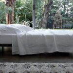 BED MILANO BY DE BAS, D URBINO, LOMAZZI 1983. STEEL FRAME WITH BENT BEECH STRIPS.STEEL FEET, WITH NATURAL OR BLACK NICKEL-SATIN FINISH THAT ALLOW DIFFERENT HEIGHTS OF THE BED. REMOVABLE FABRIC OR LEATHER COVER, OR NON- REMOVABLE IN COWHIDE. THE VERSION IN COWHIDE HAS THE STITCHING IN WHITE THREAD. UPON REQUEST THE BED SIZE FOR 210 CM. LONG MATTRESS IS ALSO AVAILABLE. ARCHITECT AND DESIGN STUDIO DE PAS, D URBINO & LOMAZZI WAS FOUNDED BY A TRIO OF IMPORTANT ITALIAN DESIGNERS OF THE SAME NAME WHO ARE BEST KNOWN FOR THEIR UNCONVENTIONAL SEATING DESIGN INCLUDING POP-CULTURE ICONS SUCH AS THE INFLATABLE BLOW AND THE KITSCHY JOE SOFA. DESIGNING IN THE 1960S, 1970S AND 1980S IN MILAN, THE COLLECTIVE IS REMEMBERED FOR ITS EFFORTS TO CONNECT RADICAL DESIGN WITH EVERYDAY LIFE.