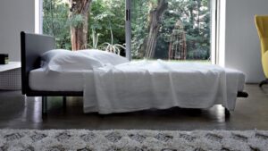 BED MILANO BY DE BAS, D URBINO, LOMAZZI 1983. STEEL FRAME WITH BENT BEECH STRIPS.STEEL FEET, WITH NATURAL OR BLACK NICKEL-SATIN FINISH THAT ALLOW DIFFERENT HEIGHTS OF THE BED. REMOVABLE FABRIC OR LEATHER COVER, OR NON- REMOVABLE IN COWHIDE. THE VERSION IN COWHIDE HAS THE STITCHING IN WHITE THREAD. UPON REQUEST THE BED SIZE FOR 210 CM. LONG MATTRESS IS ALSO AVAILABLE. ARCHITECT AND DESIGN STUDIO DE PAS, D URBINO & LOMAZZI WAS FOUNDED BY A TRIO OF IMPORTANT ITALIAN DESIGNERS OF THE SAME NAME WHO ARE BEST KNOWN FOR THEIR UNCONVENTIONAL SEATING DESIGN INCLUDING POP-CULTURE ICONS SUCH AS THE INFLATABLE BLOW AND THE KITSCHY JOE SOFA. DESIGNING IN THE 1960S, 1970S AND 1980S IN MILAN, THE COLLECTIVE IS REMEMBERED FOR ITS EFFORTS TO CONNECT RADICAL DESIGN WITH EVERYDAY LIFE.