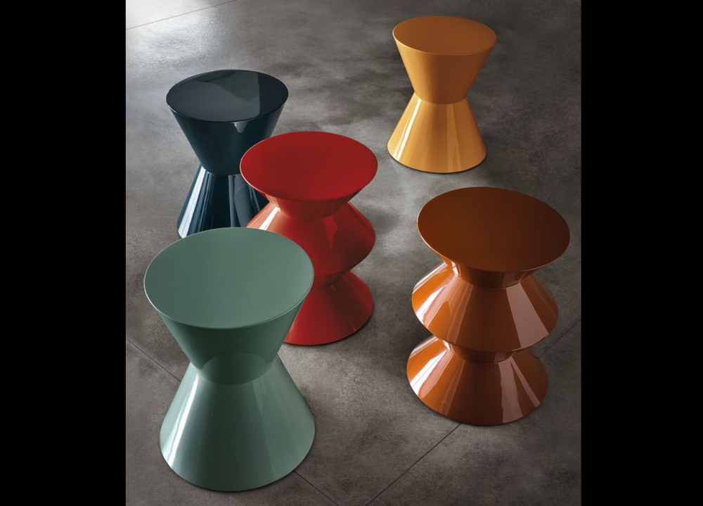 CESAR ACCENT TABLE by RODOLFO DORDONI, designed in 2004. Whether it presents itself as a side table, pouf or decor element, CESAR, with its eclectic personality and strong formal presence, has definitely joined the icons of MINOTTI, becoming an undisputed global best-seller. Designed by RODOLFO DORDONI in 2004, this year, the famous sculpture-object is turning this year 15 years old. For use in a group composition, or on its own, it comes in two different forms moulded in structural polyurethane, a material that cannot be deformed or altered. With a versatile range of uses, it is a true all-purpose piece of furniture, capable of migrating from the living area to the bedroom, from residential environments to those of the hospitality industry and even to workplaces. The story of CESAR has been told over the years through a vibrant palette of no less than 17 glossy lacquered finishes. In 2019, an important intervention on the colour scheme has entailed the addition of the powder pink colour to the current range of glossy colour variants and the introduction of three new shades - sage, bordeaux and mocha - in a brand new matt finish.