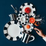 Since 1863 the company bearing my family‚Äôs name has been synonymous with Limoges porcelain. Over time, BERNARDAUD  has grown into a major player in the decorative arts, tableware and French art de vivre. This year we celebrate our 160th anniversary. Time passes, shapes and strengthens us. It reigns supreme in our workshop in Limoges: we take it and don¬¥t count it to achieve perfection...A luxury, nowadays, which lies in each gesture and each attention of our craftsmen.  ROYALE COLLECTION IN DARK BLUE BY OLIVIER GAGN√àRE - 1995.THIS ICONIC MODEL WAS ORIGINALLY CREATED FOR THE OPENING OF THE SALON DE TH√â BERNARDAUD, LOCATED IN THE GALERIE ROYALE IN PARIS