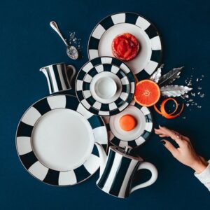 Since 1863 the company bearing my family‚Äôs name has been synonymous with Limoges porcelain. Over time, BERNARDAUD  has grown into a major player in the decorative arts, tableware and French art de vivre. This year we celebrate our 160th anniversary. Time passes, shapes and strengthens us. It reigns supreme in our workshop in Limoges: we take it and don¬¥t count it to achieve perfection...A luxury, nowadays, which lies in each gesture and each attention of our craftsmen.  ROYALE COLLECTION IN DARK BLUE BY OLIVIER GAGN√àRE - 1995.THIS ICONIC MODEL WAS ORIGINALLY CREATED FOR THE OPENING OF THE SALON DE TH√â BERNARDAUD, LOCATED IN THE GALERIE ROYALE IN PARIS