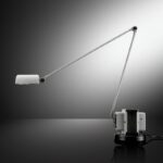 DAPHINE table lamp by TOMMASO CIMINI 1975. Since 1975 this lamp has represented the essence of Lumina. It is displayed in some of the most famous Museums of Modern Art and Design in the World.  DAPHINE is a timeless synthesis of function and form: an articulated arm, with a pivoting diffuser, mounted on a transformer. Available now with LED version, identical to the CLASSIC DAPHINE in shape and in movement, but with a more powerful light against lower consumptions. Table standing lamp in metal an articulated arm and diffuser pivoting on 360¬∞. The base of cast iron comes black varnished. Available with LED light source. Two step switch and dimmer.  This true icon of design has earned its place in the world‚Äôs major design and contemporary art museums, including the Brooklyn Museum and Judd Foundation in New York, the Mus√©e des Arts D√©coratifs in Paris, Die Neue Sammlung in Munich and The Israel Museum in Jerusalem.