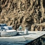 DALA collection - LOVESEAT  - designer STEPHEN BURKS. DALA takes inspiration from the artisanship and improvised seating arrangements of the developing world. Surface and structure merge in this versatile collection by STEPHEN BURKS, each piece starting as a powder-coated frame of aluminum mesh through which Dedon¬¥s master weavers thread colorful strands of our revolutionary new ecological fiber. .