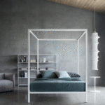 ALUMINIUM bed designed by BRUNO FATTORINI.The rigor of forms got through the lens of simplicity, accompanied by a great expressive strength: BRUNO FATTORINI‚Äôs  ALUMINIUM bed means all that. A bed made of aluminium, a lightweight and flexible material that gives a contemporary touch to this furnishing solution, which also comes in the romantic version with canopy, as well as 30 or 65 cm high headboard. The lacquered model is very cool, in glossy or matt painted aluminium, in the following colours: black, white and red, fit for modern and evolving night areas.