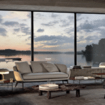 BELT sofa by RODOLFO DORDONI, designed 2022.The distinctive characteristic and inspiration behind the BELT family, designed in the all-fabric or leather versions, is the idea of a belt that draws the profile of the body, encircling it, then breaking off and fastening on the front of the seat.