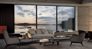 BELT sofa by RODOLFO DORDONI, designed 2022.The distinctive characteristic and inspiration behind the BELT family, designed in the all-fabric or leather versions, is the idea of a belt that draws the profile of the body, encircling it, then breaking off and fastening on the front of the seat.