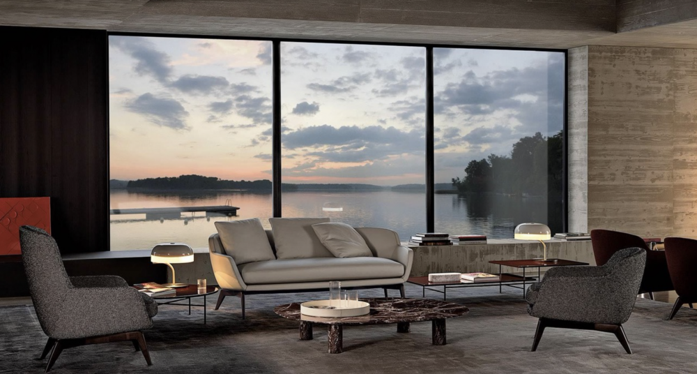 BELT sofa by RODOLFO DORDONI, designed 2022.The distinctive characteristic and inspiration behind the BELT family, designed in the all-fabric or leather versions, is the idea of a belt that draws the profile of the body, encircling it, then breaking off and fastening on the front of the seat.