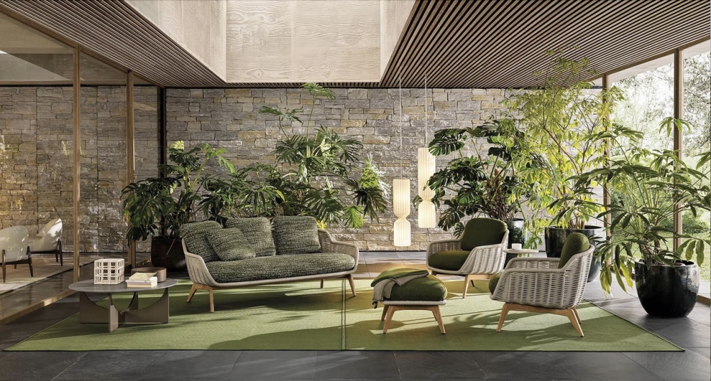 BELT CORD OUTDOOR by RODOLFO DORDONI, designed in 2022.The BELT CORD OUTDOOR family is composed of a two-seater sofa, bergere, armchair, ottoman, lounge and dining armchairs, all also available with natural finish teak legs. With a more classic feel and a warmer aesthetic, this version can be easily combined with all the other furnishing pieces in the outdoor collection.