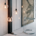 Adjustable table  E 1027 (1926) by EILEEN GRAY. Created by GRAY for her modernist villa in Roquebrune - Cap - Martin, this height - adjustable, cantilevered table was said to have been designed to allow Gray's sister to eat breakfast in bed. Groundbraking for its time, the tubular frame construction still feels contemporary almost a century on.