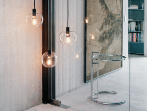 Adjustable table  E 1027 (1926) by EILEEN GRAY. Created by GRAY for her modernist villa in Roquebrune - Cap - Martin, this height - adjustable, cantilevered table was said to have been designed to allow Gray's sister to eat breakfast in bed. Groundbraking for its time, the tubular frame construction still feels contemporary almost a century on.