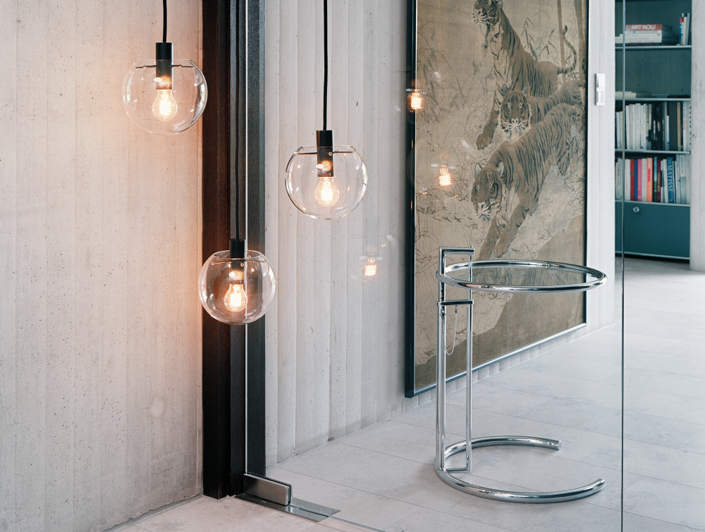 Adjustable table  E 1027 (1926) by EILEEN GRAY. Created by GRAY for her modernist villa in Roquebrune - Cap - Martin, this height - adjustable, cantilevered table was said to have been designed to allow Gray's sister to eat breakfast in bed. Groundbraking for its time, the tubular frame construction still feels contemporary almost a century on.