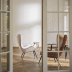 CONTESSA 1956 High-Back Chair. The original was the first modern piece of furniture produced by Wittmann after the war: a ‚Äúsporty piece‚Äù raked sharply backwards and firmly upholstered like a sports car seat. All of the experience built up by the manufacturer over the past 60 years ‚Äì as well as state-of-the art technology and materials ‚Äì went into developing this modern-day reedition.