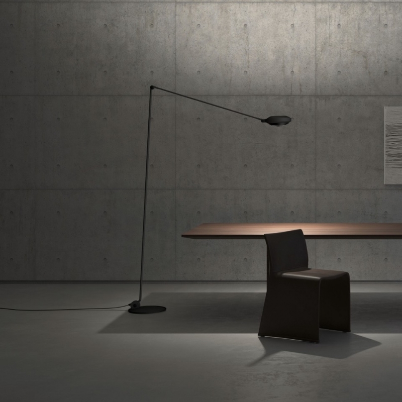 Floor lamp ELLE by TOMMASO CIMINI. A minimal yet notable floor lamp series, ELLE can be used both for direct and for diffused lighting. Jointed arm, adjustable reflector and special grid for glare control are ELLE‚Äôs defining features. Available with one or two jointed arms. Identical in shape and size to the historic halogen version, ELLE LED is renewed with a superior luminous flux and a consumption lower than 50W. The adoption LED technology ensures a very high color quality. ELLE LED, available with double or single arm, has a double dimmable light emission: direct 25W with anti-glare grid and 20W indirect. Aluminum and steel body, foot dimmer on the cable.