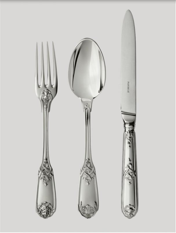 MOLI√àRE MASCARON cutlery collection. This Regency-style (1690-1730) sterling silver model is distinguished by the elegance of its form and its refined naturalistic decor. Acanthus flowers and stylized ribbons dramatically intertwine to embellish the handles of the cutlery. The tips of the fork and knife are molded with a theatrical mask face and the spoon features a vegetal mascaron.