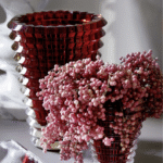 EYE VASE ROUND XL.  The wavy design of the crystal EYE vase comes from an extraordinary technique: exterior horizontal cuts and interior vertical cuts combine to produce a magic visual effect.