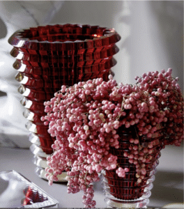 EYE VASE ROUND XL.  The wavy design of the crystal EYE vase comes from an extraordinary technique: exterior horizontal cuts and interior vertical cuts combine to produce a magic visual effect.