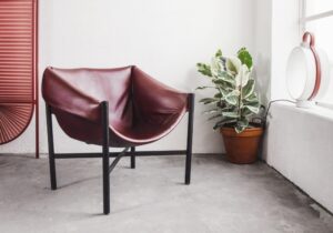 FALSTAFF chair by STEFAN DIEZ - the unconventional way the seat is fixed to the tubular frame is carefully studied in all details. The chair is a result of letting the eye wonder outside the limits of upholstering, resulting in an opulent seat.
