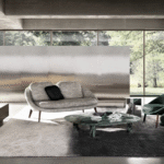 LIDO sofa by GAMFRATESI, designed 2022.The welcoming nest shape of the LIDO family of seats by Italian-Danish duo GAMFRATESI is the hallmark of its design. The curved silhouette that outlines the body on which the padding of the seat sits now also comes in a two-seater sofa version: a compact furnishing piece, ideal for both home and Hospitality spaces.