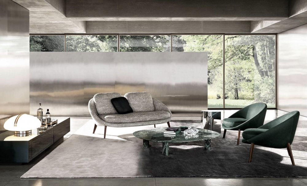 LIDO sofa by GAMFRATESI, designed 2022.The welcoming nest shape of the LIDO family of seats by Italian-Danish duo GAMFRATESI is the hallmark of its design. The curved silhouette that outlines the body on which the padding of the seat sits now also comes in a two-seater sofa version: a compact furnishing piece, ideal for both home and Hospitality spaces.