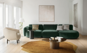 GINZA sofa designed by ELLEN BERNHARDT and PAOLA VELLA. GINZA  is a sofa system with sinuous and sensual shapes. Inspired by organic shapes reminiscent of 1970s design, it transforms any space into a warm and familiar landscape, spreading a pleasant sense of home comfort. Soft and enveloping lines recur in all the elements of the collection, which includes various modules that allow the creation of linear compositions, angular or unusual shapes, always characterized by the play of shapes and a cozy looking depth.