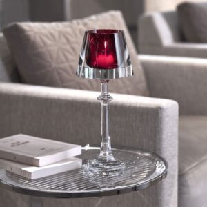 HARCOURT MY FIRE candlestick red. Set in a transparent light-shade, a HARCOURT red goblet now serves as a votive. Filtered by magic crystal, the candle creates an enchanting atmosphere. A collector's item for all lovers of creative design. Price ‚Ç¨750