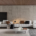 GOODMAN modular seating system by RODOLFO DORDONI , designed 2022.The system is suspended from the floor on refined Bronze or Polished Chrome metal feet, set back from the edge, and a perimeter frame that matches the same finishes; the optical effect of suspension in Goodman enhances the softness of the seat, offering a super-comfortable welcome. The volume of the one-piece seat is particularly ergonomic and comfortable thanks to the use of the innovative technology used: the system of pocket springs is combined with a layer of polyurethane padding in layered densities that give a consistent sensation of softness and cosiness.