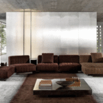 TWIGGY modular seating system by RODOLFO DORDONI , designed 2022.TWIGGY is the new family of seats that stands out for its ability to revolutionise living spaces with an unprecedented ideal of timeless beauty.TWIGGY presents itself with different elements, always distinguished by MINOTTI's sophisticated sartorial taste. The family originated as a single armchair in the Small, Large and Deep versions, with and without armrests, but embellished with stitching that reveals the depth of the brand's manufacturing know-how combined with its great ability to make even the most sculptural seats extremely comfortable.