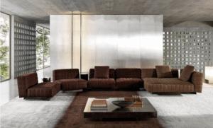 TWIGGY modular seating system by RODOLFO DORDONI , designed 2022.TWIGGY is the new family of seats that stands out for its ability to revolutionise living spaces with an unprecedented ideal of timeless beauty.TWIGGY presents itself with different elements, always distinguished by MINOTTI's sophisticated sartorial taste. The family originated as a single armchair in the Small, Large and Deep versions, with and without armrests, but embellished with stitching that reveals the depth of the brand's manufacturing know-how combined with its great ability to make even the most sculptural seats extremely comfortable.