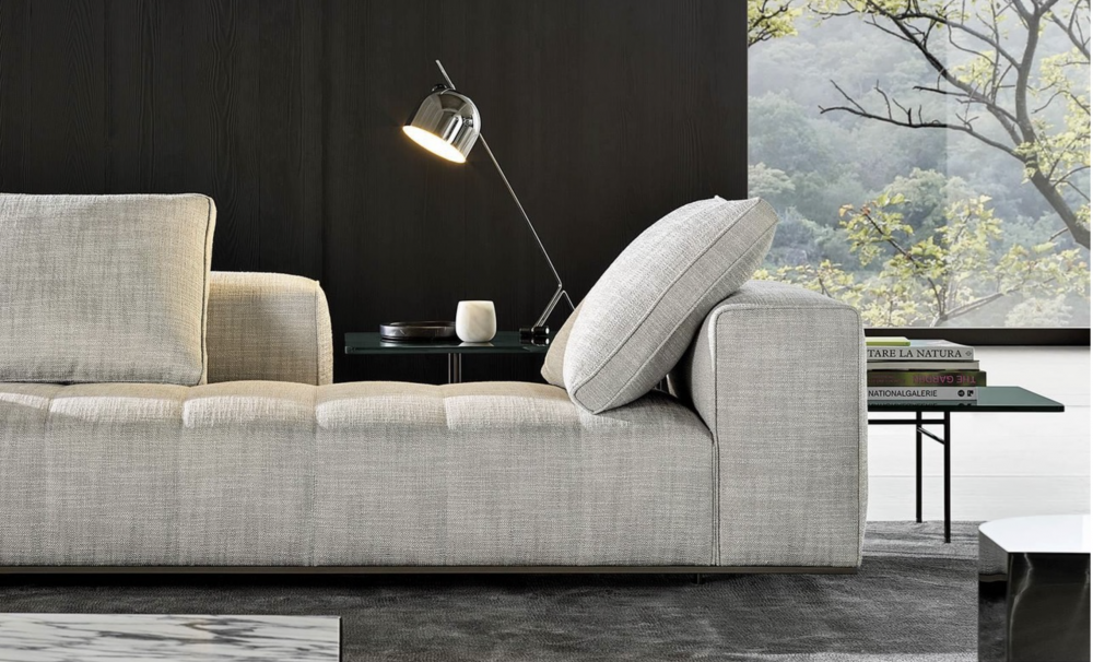 GOODMAN modular seating system by RODLOFO DORDONI , designed 2022.Compactness and softness come together in the same sofa concept, making it suitable for a more formal use both also for extreme relaxation; from the most traditional configurations to the more dynamic ones made possible by a series of individual components that animate the living space: end units, corner units, central units, chaise-longues. Each element is like a piece of a jigsaw puzzle to be joined with others to define its creator‚Äôs own home environment. Compact volumes capable of adapting to the space, the needs and tastes of the individual, as well as to the evolution of his or her living requirements over the years, easily changing into new compositions.