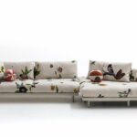 JOSH SOFA BY EDWARD VAN VLIET, 2018.IT IS THE MAIN PLAYER IN THE LIVING ROOM WHERE EVERYTHING STARTS. IT FITS PERFECTLY IN A CITY LOFT AS MUCH AS IN SUMMER HOUSES THANKS TO ITS NATURAL TOUCH COMING FROM THE COTTON ENRICHED WITH A STITCHED PATTERN REMINISCENT OF THE TRADITIONAL JAPANESE FUTON AND THE PRINTED LINEN IKEBANA GRAPHICS. THE RESULT IS A BEAUTIFUL MATCH BETWEEN ROUGH NATURAL FABRIC AND LATEST PRINTING TECHNOLOGY.