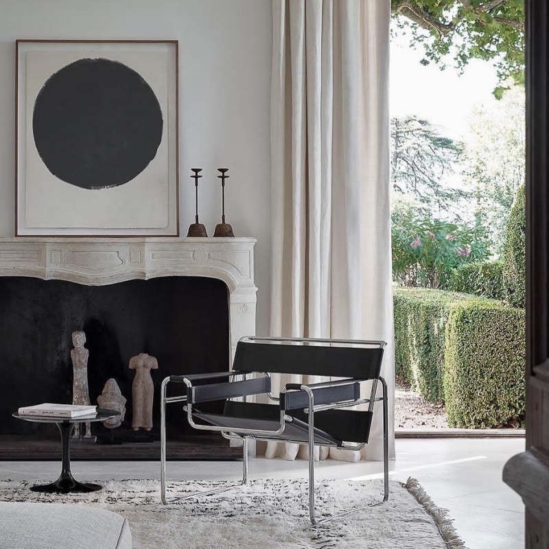 WASSILY by MARCEL BREUER, designed in 1925. MARCEL BREUER was an apprentice at the Bauhaus when he conceived the world‚Äôs first tubular steel chair. Inspired by the frame of a bicycle, a product he greatly admired for its functional design, BREUER saw tubular steel as a way of building a more transparent chair. Influenced by the constructivist theories of the Dutch De Stjil movement, BREUER took a familiar form ‚Äî in this case the classic club chair ‚Äî and reduced it to its elemental lines and planes. The composition of leather strips suspended on steel tubes was the first chair of its kind. BREUER later named the chair after Wassily Kandinsky, the first person to whom he showed the chair.