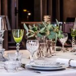 Crystal wine glasses MASS√àNA; glasses V√âGA by SAVINEL & ROZ√à; candle holders OUR FIRE by PHILIPPE STARCK.