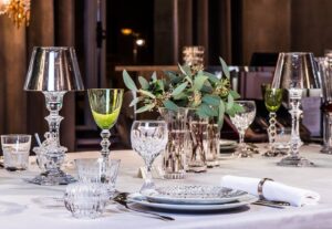 Crystal wine glasses MASS√àNA; glasses V√âGA by SAVINEL & ROZ√à; candle holders OUR FIRE by PHILIPPE STARCK.