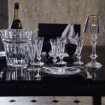 Crystal champagne glasses and champagne cooler HARCOURT; candle holder OUR FIRE by PHILIPPE STARCK