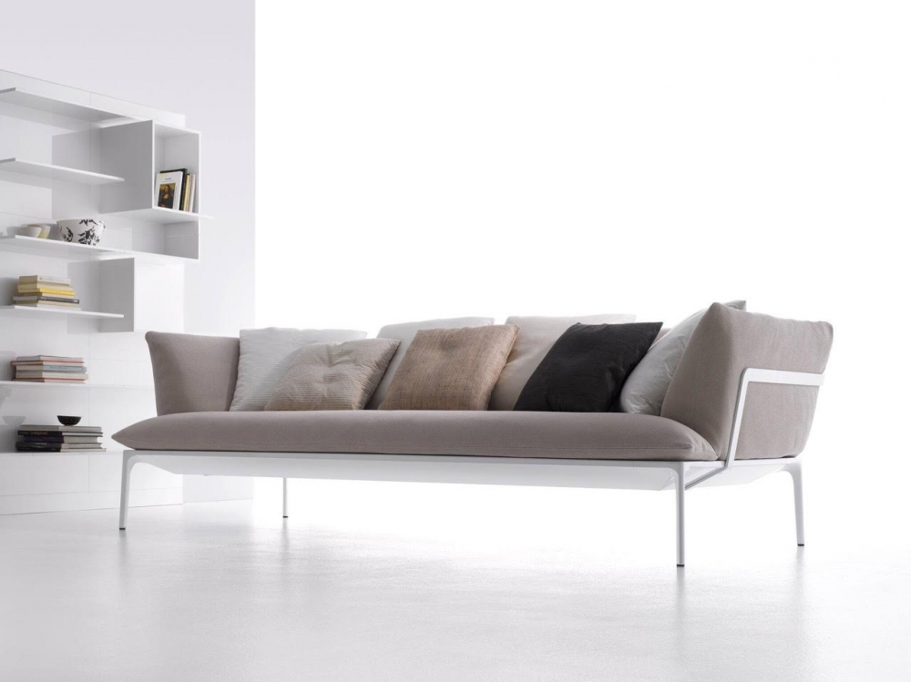YALE SOFA by JEAN-MARIE MASSAUD, designed in 2009‚Äì2011. A minimal structure of extruded aluminium embodies reduction and lightness. Cradling cloud-like pillows, it supports a solid seating system with firm cushions. MASSAUD‚Äôs vocabulary for this line also translates into low coffee tables, both square and rectangular. The designer‚Äôs YALE COLLECTION of sofas, armchairs, and tables synthesizes form, function, and beauty, personalized pieces with varied colours, densities, and materials. MASSAUD has done more than simply design a product. He has imagined a way to enhance how people live. YALE SOFA by JEAN-MARIE MASSAUD was awarded the Compasso D'Oror Award in 2011.