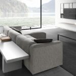 MATE 2012 SOFA by ROBIN RIZZINI, designed in 2012. A system of sofas and sectionals. With a frame in solid wood and elastic belts and a filling in indeformable variable-density polyether and down, or in polyester wadding. The new top stitched seam highlights the arms in the end, corner and special units.