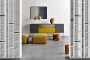 HERON by RODOLFO DORDONI, designed in 2016. System of storage units with doors, drawers and open compartments for the different domestic, office and public environment. Collection composed of different storage units in terms of dimensional combinations and frontal equipment.