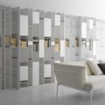 RANDOM BOOKSHELVES by NEULAND INDUSTRIEDESIGN, designed in 2017. An icon, an industrial masterpiece with an extraordinary irregular structure.  A piece of furniture that, when it was born in 2005, revolutionised the concept of bookshelf, turning it into a design sculpture. This is the visiting card of RANDOM by NEULAND INDUSTRIEDESIGN, created all white at the beginning. Then, it came in different variants up to the colour of the 2C-3C release. A product that, with its geometries, favours light games, while with its modularity adapts to any living space, from the widest to the most reduced ones. Over the years, RANDOM has extended its family, changing the concept of storage. For instance, with RANDOM BOX and RANDOM CABINET, objects can be both stored and shown off, while modules of different depth give an effect of considerable dynamism. Even today, MDF Italia RANDOM expresses an extraordinary communication energy and it is one of the icons of the whole design world.