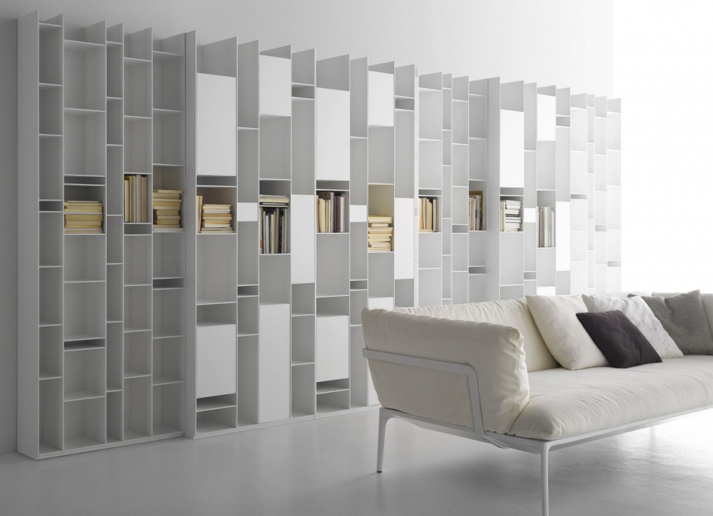 RANDOM BOOKSHELVES by NEULAND INDUSTRIEDESIGN, designed in 2017. An icon, an industrial masterpiece with an extraordinary irregular structure.  A piece of furniture that, when it was born in 2005, revolutionised the concept of bookshelf, turning it into a design sculpture. This is the visiting card of RANDOM by NEULAND INDUSTRIEDESIGN, created all white at the beginning. Then, it came in different variants up to the colour of the 2C-3C release. A product that, with its geometries, favours light games, while with its modularity adapts to any living space, from the widest to the most reduced ones. Over the years, RANDOM has extended its family, changing the concept of storage. For instance, with RANDOM BOX and RANDOM CABINET, objects can be both stored and shown off, while modules of different depth give an effect of considerable dynamism. Even today, MDF Italia RANDOM expresses an extraordinary communication energy and it is one of the icons of the whole design world.