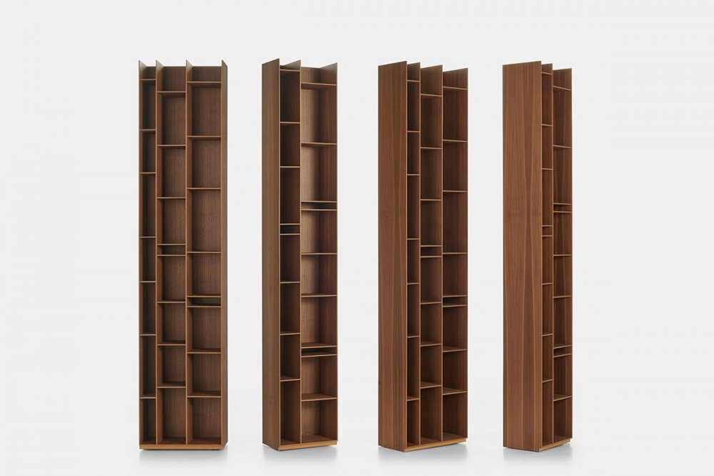 RANDOM WOOD 2C - 3C BOOKCASES by NEULAND INDUSTRIEDESIGN, designed in 2020. A new refined Canaletto walnut finish dresses the iconic RANDOM bookcase in the 2C-3C version. An elegant texture with darker veins enhances the natural beauty of the wood, giving a warm and welcoming atmosphere to the environments in which it is installed, from the living room to the dining room. Thanks to its timeless character, the new RANDOM WOOD 2C-3C adapts harmoniously to any context and style, from the most classic to the most modern, characterizing every interior with personality.  Designed in 2005 by NEULAND INDUSTRIEDESIGN, RANDOM is an icon of the MDF Italia collection which expanded its range over the years with the introduction of the 2C and 3C options in 17 shades. A modular bookcase, which can be used individually for small spaces, or in combination with other colour shades to create larger compositions.