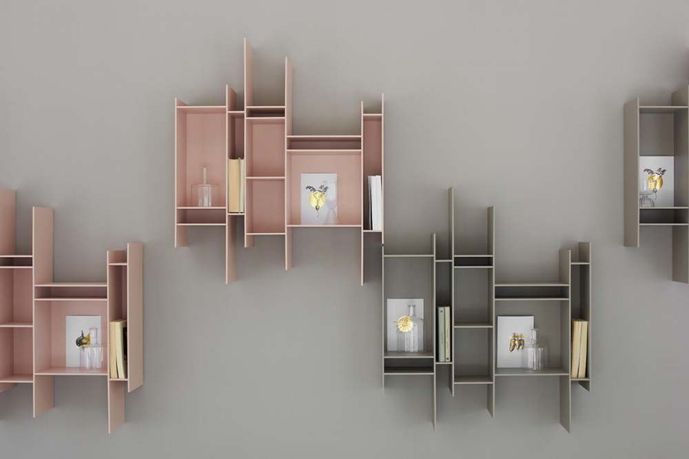 RANDOMITO by NEULAND INDUSTRIEDESIGN, designed in 2011. A graphic sign on the wall that catches the eye. A small but endearing hanging bookcase, able to confer dynamism to any environment and embellish it as an artwork. This is the main feature of RANDOMITO, whose single and vertically reversible module can be used both individually and by aggregation, thus getting plenty of customised configurations. Also the colour palette has been added more shades over the years: not only pure white but other seven shades, including pastel ones. NEULAND INDUSTRIEDESIGN conceived a bookcase evoking movement and lightness, whose silhouette is unmistakable: one in a kind, it is inspired to the ‚Äúprogenitor‚Äù Random, representing one of its evolutionary paths. Wonderful in residential contexts, RANDOMITO lends itself excellently to business spaces.