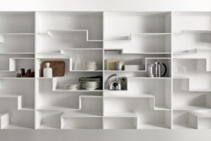 MELODY by NEULAND INDUSTRIEDESIGN, designed in 2008. An individual flexible and customised furnishing solution, not just a simple bookcase. This is MELODY‚Äôs visiting card, offering a comfortable and eye-catching horizontal storage, also for big objects. The layout of the shelves with its gritty graphic pattern, sends an idea of movement, a sort of discreet waving. Functionality and modularity have always been key features for the designer duo NEULAND INDUSTRIEDESIGN, together with a catchy and innovative design. In this case the module is single, but always vertically revertible, which allows to give horizontal continuity or discontinuity to the shelves, by combining more modules. Offered either in a monochromatic version or with contrast backrest, Melody can be modified in time and space, for unique environments.