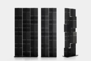 DEVIDE IT by PITSOU KEDEM, designed in 2020. In today's dynamic world, designing products that adapt to change is essential. Design and functionality must go hand in hand to offer life to solutions that are not only aesthetically beautiful, but also able to adapt to the transformations we are witnessing. This contributed to change and redraw domestic and working spaces: people work in a pub, at home or share common workspaces. DIVIDE IT was created to meet these needs. Designed by the Israeli architect PITSOU KEDEM, who has already created the Mirror Lines collection for MDF Italia and signed several stunning residential projects, it is a dynamic product that adapts to every requirement and allows you to divide working spaces and home environments. At the same time, it maintains the sense of contiguity between adjacent rooms and creates suggestive and elegant perceptions. DIVIDE IT is a furniture complement that moves easily and can change position at any time the user wishes. Available in two different sizes, it is composed of several panels which, rotating on an axis of 360 degrees, can be positioned to determine the passage of light and sound.