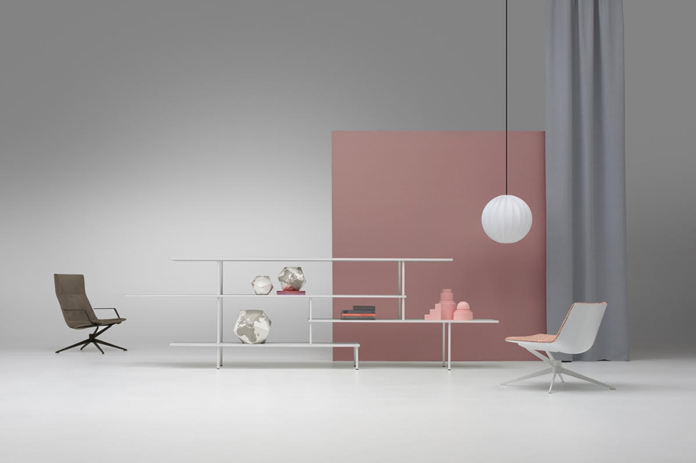 NEIL ARMCHAIR by JEAN-MARIE MASSAUD, designed in 2019. NEIL LOUNGE CHAIR and ARMCHAIR are celebrating lightness and competence. A radical language, a cosy comfort and an elegant technique that match surprisingly well with refined, natural finishes. Now introduced in a four-star version, this new collection leaves space for further future options and different situations and uses. The NEIL ARMCHAIR emerges today as a new icon of essential style. NEIL is presented in two new versions: BASIC and BASIC with RETURN MECHANISM. Two unique bases that redefine the classic office chair concept.