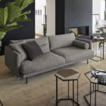 MIES SOFA sesigned by STEFANO CAVAZZANA. Contemporary stylishness and supreme comfort, this fixed or modular MIES sofa has deep inviting seat cushions that beckon you to sink in and relax.  The main feature of this sofa is the possibility of customising both the optional round headrests with metal buckles or the back cushions with any fabric from the collection. Infinitely comfortable.