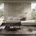 GOODMAN modular seating system by RODOLFO DORDONI, designed 2022. With a clear 1970s imprint, the inspiration  behind this design is the graphic character of those years, its ability to stratify and cross marks, reducing the complexity of things into a few distinctive features. In this way, in GOODMAN the mark of the matelass√© stitching, typical of MINOTTI's tailoring processes, draws shadows and light on the seat, creating the sensation of a quilted cross-padding.